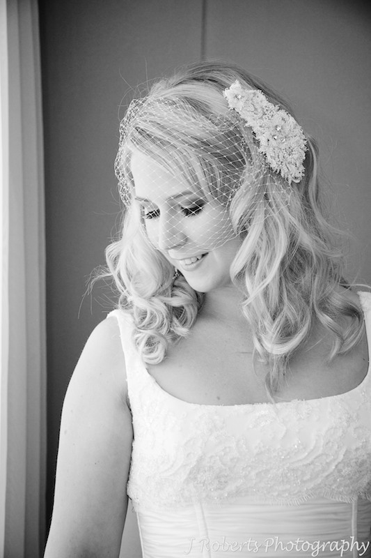 B&W of bride with fishnet veil - wedding photography sydney
